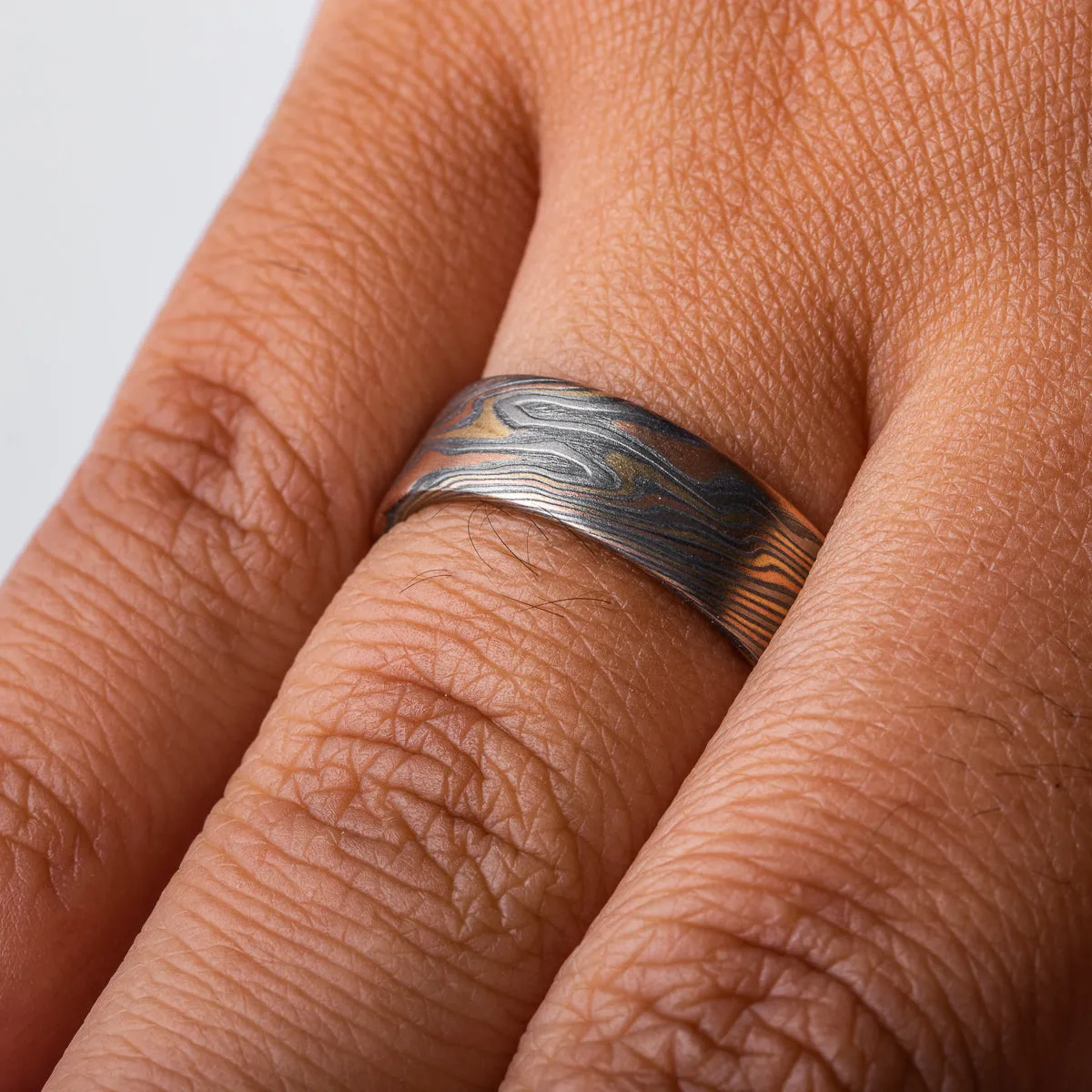 Rustic Mokume Twist Pattern Wedding Band in Firestorm Palette
