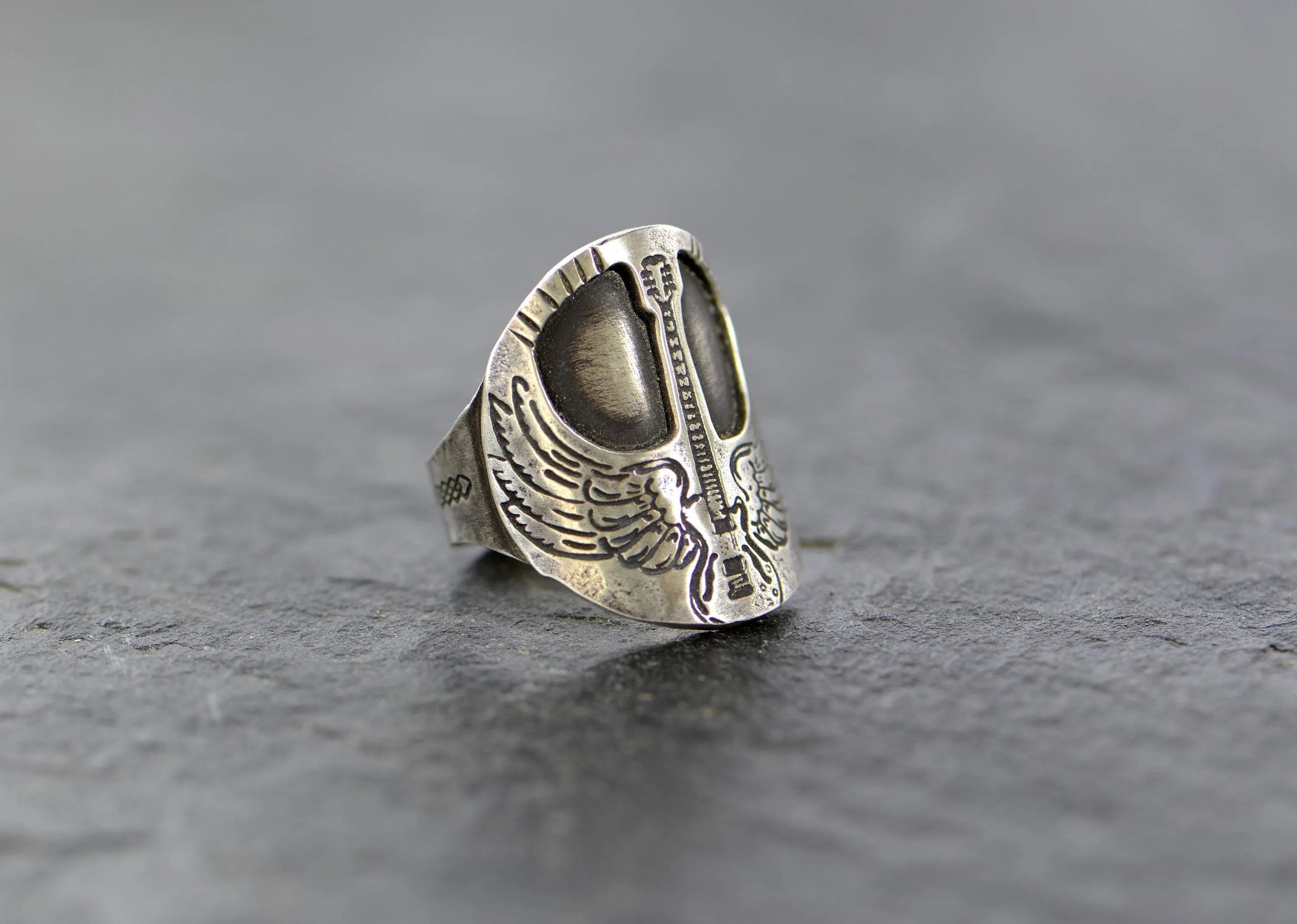 Winged guitar on  sterling silver saddle ring