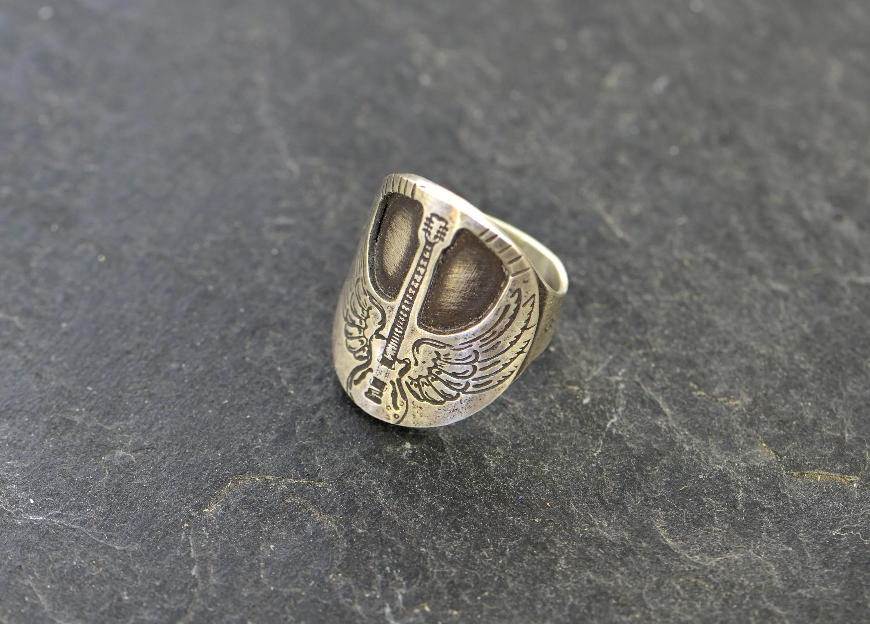 Winged guitar on  sterling silver saddle ring